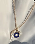 Vienna Charm Necklace with three charms attached to it