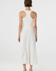 Woman wearing a white dress on a white background