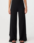 Black wide-leg pants worn by a person on a white background, front