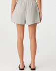 Person wearing a checkered shorts on a white background back