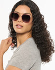 Austin 12K Titanium + Burgundy Leather Sunglasses on model with average, square face shape