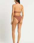 Model size XS wearing size Celeste One Piece in Fawn Shimmer, back