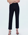 Person wearing black jeans on a white background