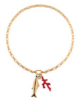 Gold chain bracelet with a red starfish and gold feather charm on a white background