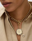 Odyssey Necklace in Baby Blue front view on model showing compass side