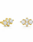 A pair of yellow gold stud earrings with small clear gemstones, shown on a clean white background.