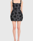 Black floral patterned dress on a white background, front