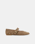 A single taupe-brown suede flat shoe with gold-tone metal studs and a matching buckle strap, shown in profile against a light gray background.
