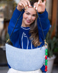 Clare V Lune Denim Suede Bag held out