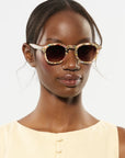 Dylan Pink Poppy Sunglasses on model with narrow, oval face shape