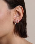 Diamond Heart Drop Earrings on model's ear in second hole