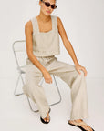 Emmie Pant in Heather Flax and Akira Top in Heather Flax, model sitting