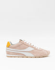 Pink sneaker with white accents on a light beige background