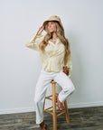 Kacey Mid Rise Cuffed Boyfriend Jean on model sitting on stool