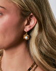 Linda Earrings on model with gold necklaces