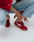Notice Suede Crimson Sneaker on model close up