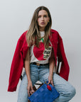 Classic Tee NYC with studded jeans and red jacket