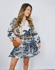 Woman wearing a floral dress with a white background