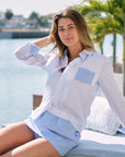 Auri Stripe Long Sleeve Button Down Shirt and Auri Stripe Skort sitting on lounge set