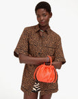 Emma Bag front view of model carrying the bag on her wrist