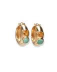 Gold hoop earrings with embedded stones on a white background