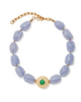 Necklace with blue beads and a gold clasp on a white background