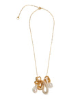 A gold chain necklace featuring a multi-strand pendant with white faux pearls and a translucent white stone, set against a plain white background.
