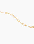Gold chain necklace on a white background