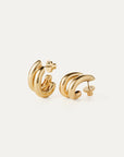 Pair of gold hoop earrings on a white background