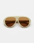 ivory sunglasses with amber lenses on a white background