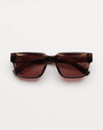 Square sunglasses with a translucent redish brown tortoiseshell frame and light red lenses, shown against a plain light gray background.