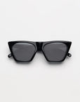 black sunglasses folded on a white background