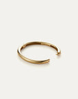 Gold bracelet on a white background