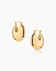 Gold hoop earrings on a white background