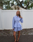 Woman wearing a light blue set, full body front
