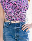 Ilida Shiny Thin Belt with floral top and blue jeans