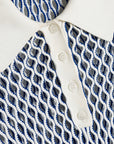 Close-up of a white shirt with blue and gray patterned collar and buttons, brand 'Simkhah' visible.