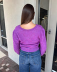Pollen Reversible Sweater back view, buttons in front