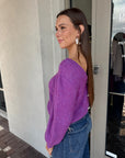 Pollen Reversible Sweater side view, buttons in back