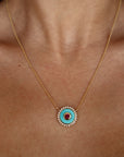 Mandala Medallion Necklace extreme close up showing turquoise side on model's neck