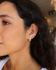 Groovy Diamond Pear Drop Earrings side view on model