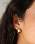 Small Margaux Puff Earrings close up front and partial side view on model