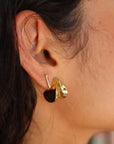 Small Margaux Puff Earrings close up side view on model