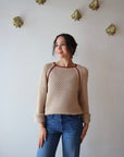 Avra Sweater front view on model with sleeves cuffed