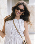 Devon Nikko Tortoise Sunglasses on model with striped blouse