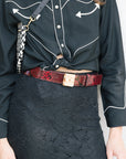 Snake Print Leather Logo Belt with lace skirt close up