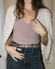 Ilida Shiny Thin Belt on model with black jeans