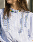 Emily Collar close up with blue top