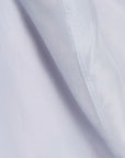 Close-up of light blue fabric with subtle texture