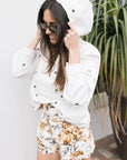 The Embroidered Crop Pullover Daisies with hood up and Palmer Short